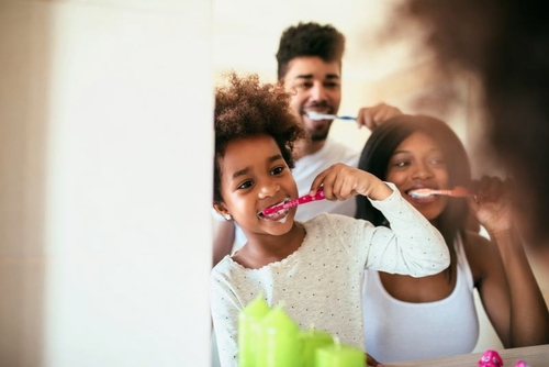 Family brushing teeth